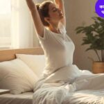 একটি শান্ত ও আরামদায়ক শয়নকক্ষের দৃশ্য, যেখানে সকালে সূর্যালোক পড়ছে। একজন ব্যক্তি বিছানায় হালকা স্ট্রেচ করছেন, সতেজ ও উদ্দীপ্ত দেখাচ্ছেন, পাশে একটি গ্লাস পানি এবং ছোট গাছ রয়েছে।