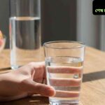 "একটি ছাত্র বা ছাত্রী ডেস্কে বসে বই এবং নোট নিয়ে পড়াশোনা করছে, পাশে ঘড়ি এবং পানি রাখার ব্যবস্থা, মনোযোগী ও প্রস্তুত চেহারা, শান্ত এবং সুসংগঠিত পড়াশোনার পরিবেশ।"