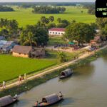 "ফরিদপুর জেলার দৃশ্য, পদ্মা নদী, ধানক্ষেত এবং ঐতিহ্যবাহী গ্রামের বাড়িসহ স্থানীয় জীবন ও সংস্কৃতি প্রতিফলিত।"